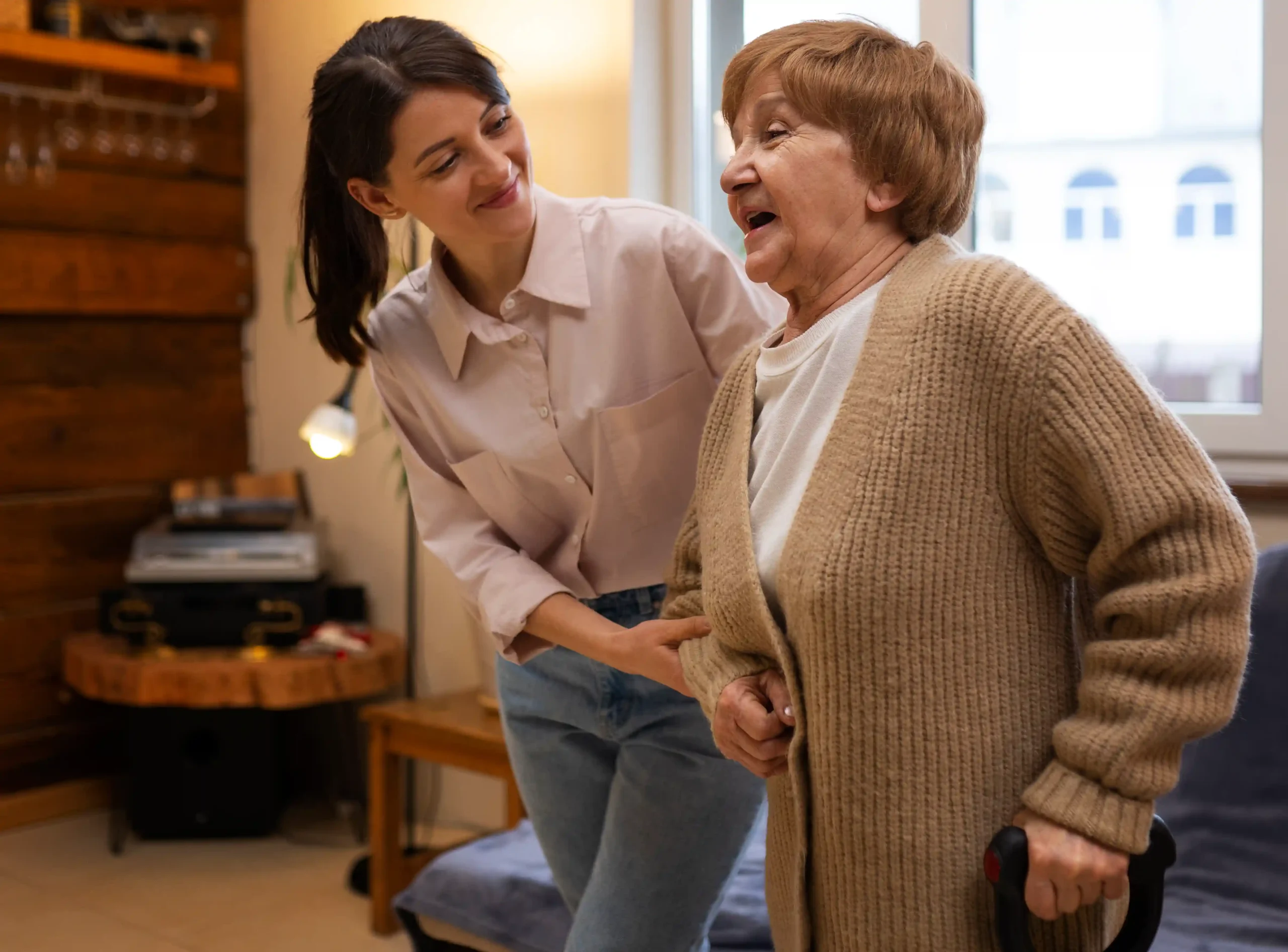 Woman helps senior lady